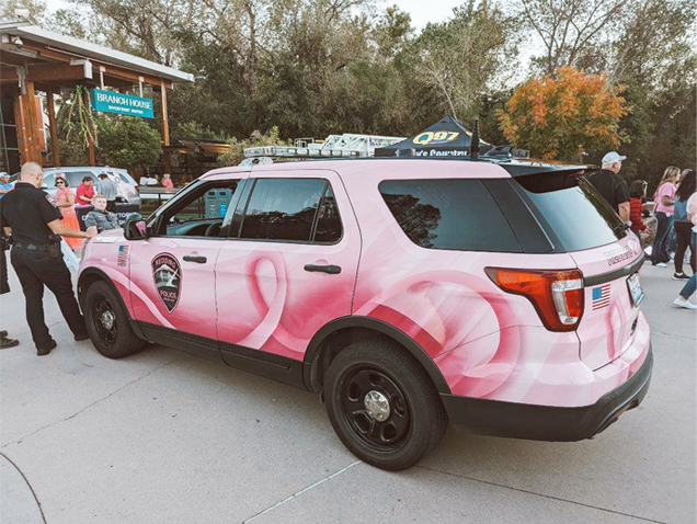 Redding Police Car with a pink breast cancer awareness ribbon wrap